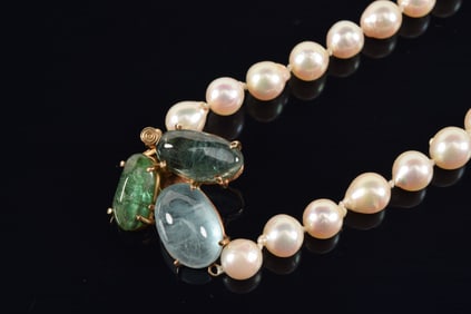 14K gold pearl bracelet with clasp set with 3 semi-precious stones. Marked 14K.