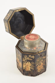 Octagonal pewter tea caddy. China. 19th century. Fitted lacquered box. Loss to the box. 9in high.