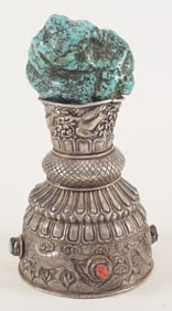 Repousse silver ewer. Tibet. 19th century. Inset with turquoise and coral. Large turquoise