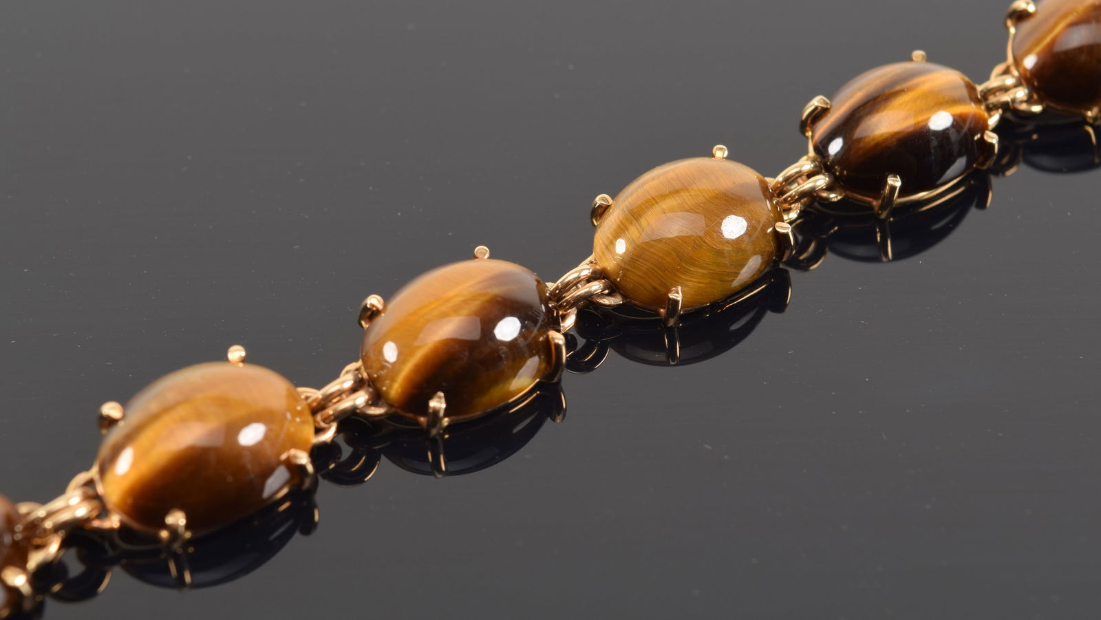 14K gold tiger's eye cabochon stone mounted bracelet. Signed Williams and marked 14K on clasp. (1 of 5)