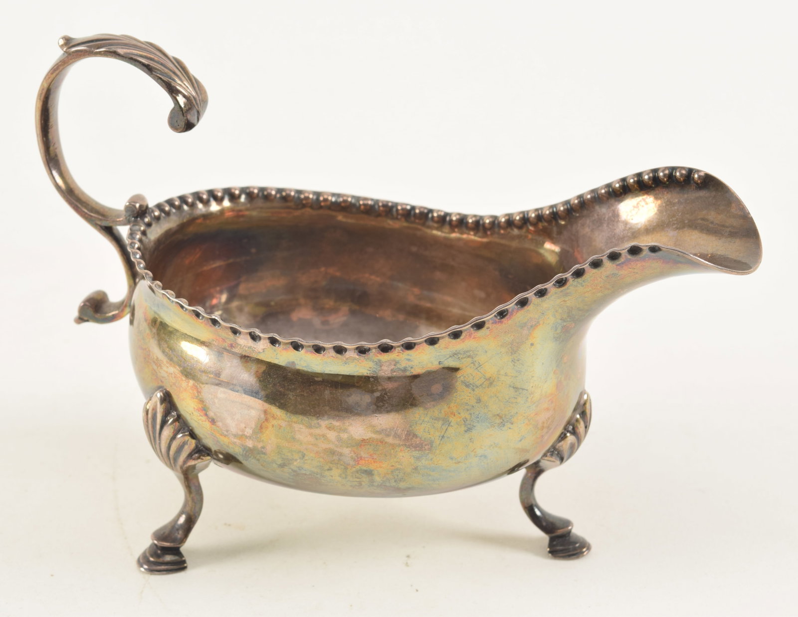 English sterling silver footed sauce boat. TW maker's mark. London, 1823. 6in length. 5.3 ozt.: English sterling silver footed sauce boat. TW maker's mark. London, 1823. 6in length. 5.3 ozt.