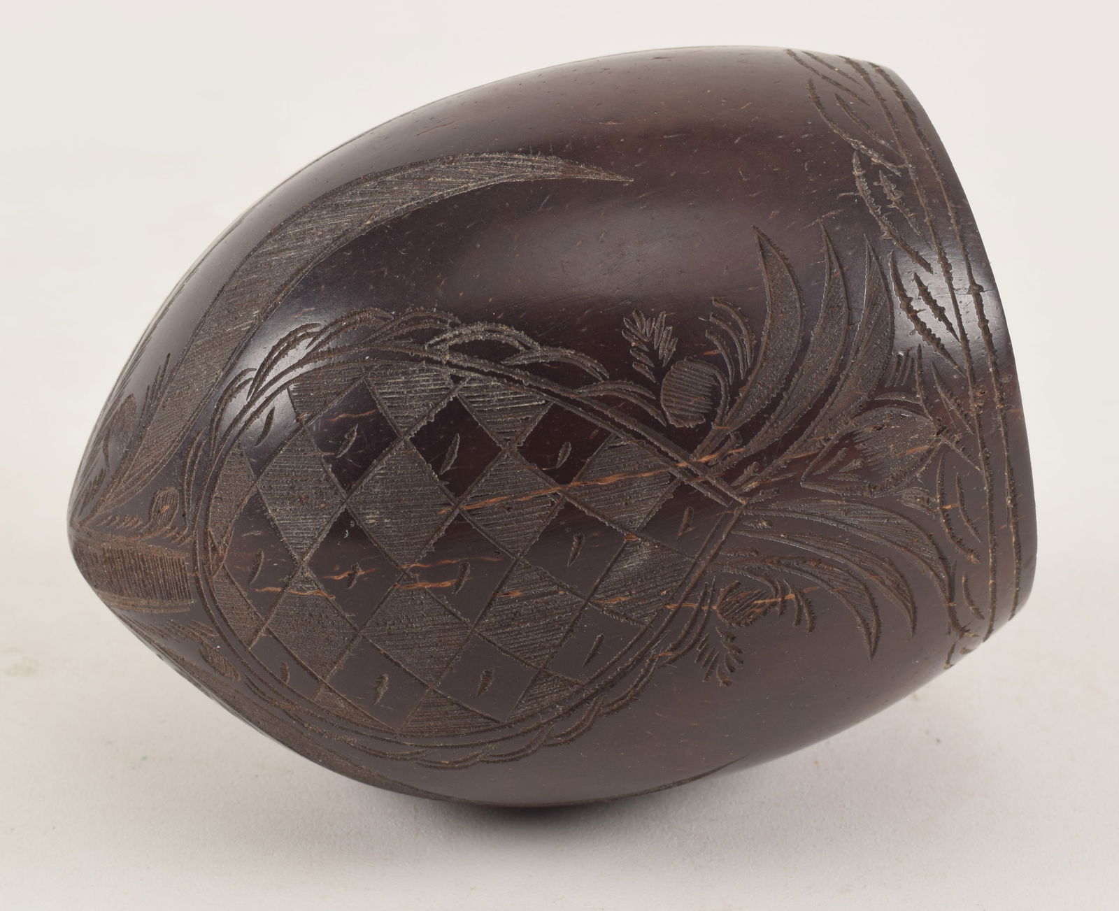 Antique carved coconut shell. Armorial, pineapple and palm tree decoration. (1 of 5)
