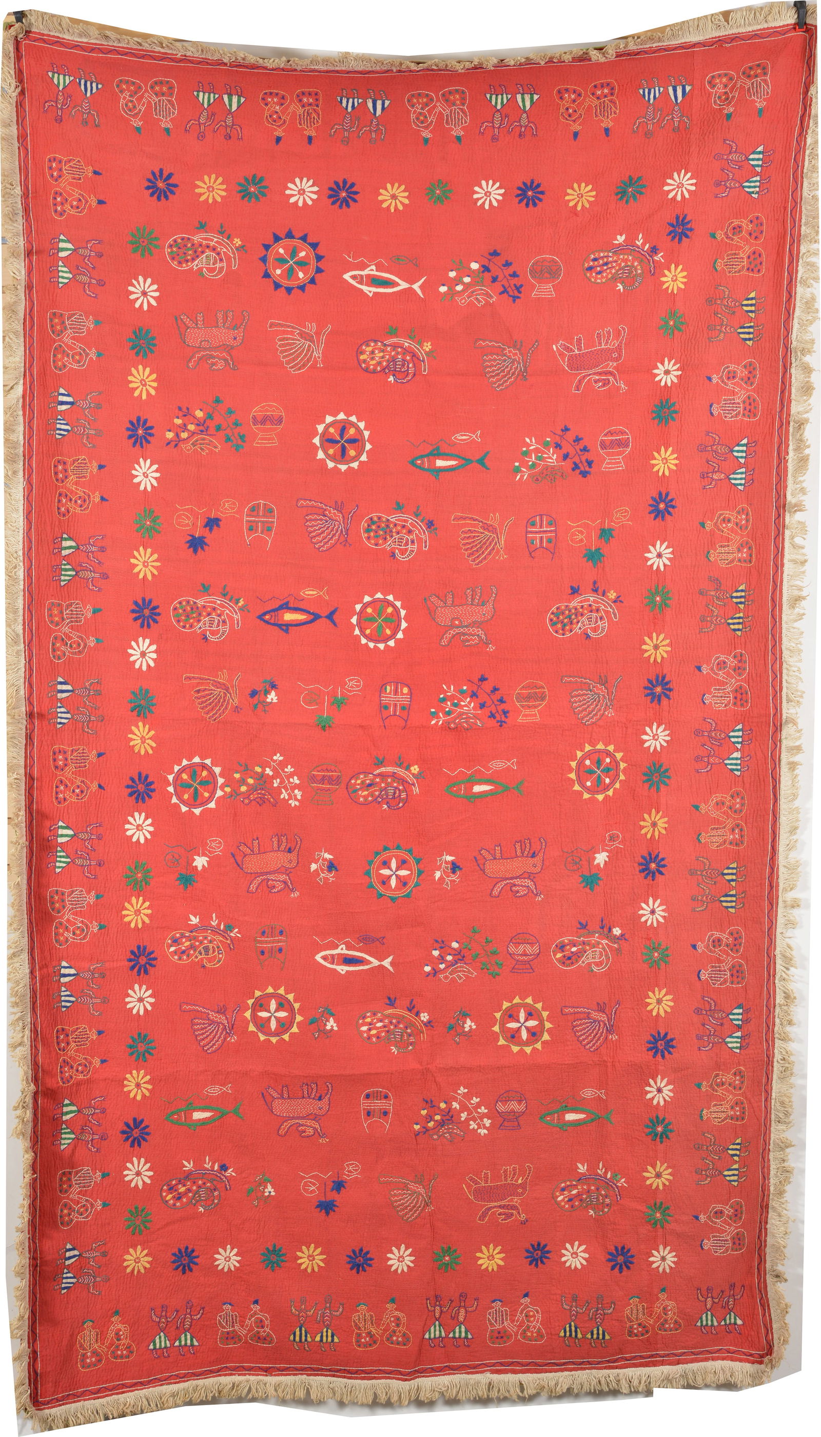 Ethnographic textile wall hanging with geometric and figural decorations on a red ground. (1 of 6)