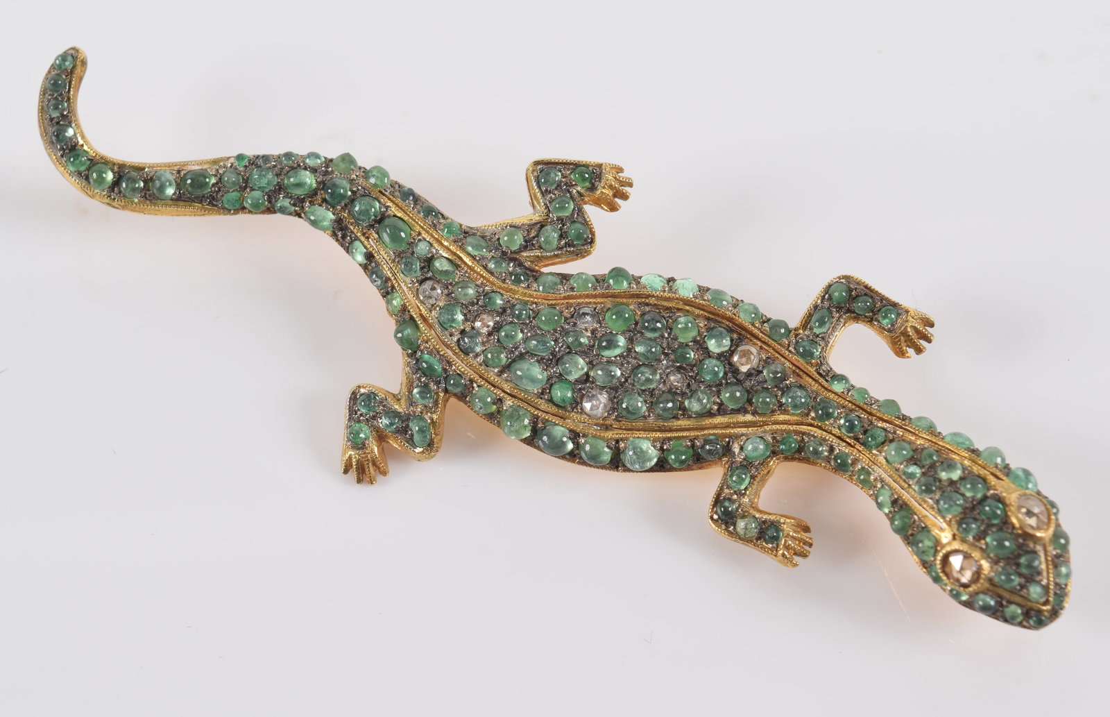 Gilt silver salamander form brooch set with rose cut diamonds and emeralds. 3in length. (1 of 3)