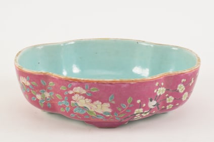 19th century Chinese famille rose plum ground shaped deep footed dish. Magpie bird and blossom