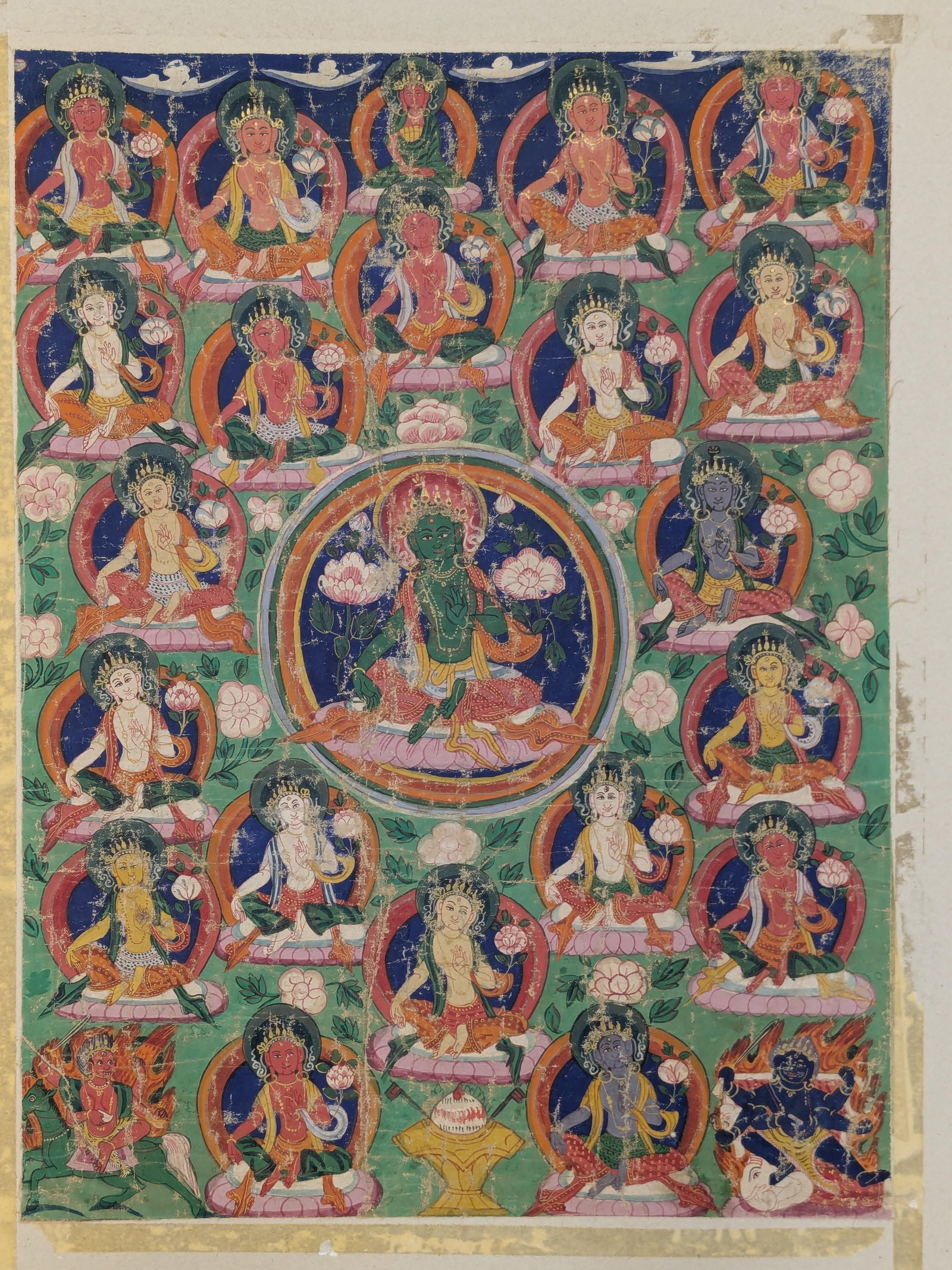 Buddhist icon. Tibet. 16th century. thangka of Green Tara with 23 Tara lineage figures. Ink and: Buddhist icon. Tibet. 16th century. thangka of Green Tara with 23 Tara lineage figures. Ink and pigments on cloth. Wear consistent with age.
