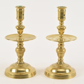Pair of 17th/18th century heavy brass mid drip candlesticks. 10.25in high.