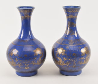 Pair of Chinese blue ground porcelain vases with gilt dragon decoration. Each with 2 dragons chasing