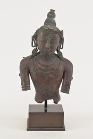 Bronze bust. Nepal. 16th century. Jeweled image of a deity. Traces of gilt remaining. 15 x 8in.