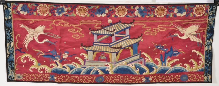 19th/20th century Chinese plum ground silk and gold metallic thread panel with crane and pavilion