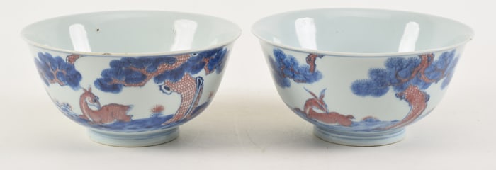 Pair of Chinese Chien Lung underglaze blue and red deer decorated porcelain bowls. Red bats, red and