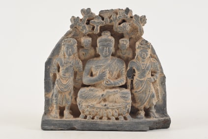 Carved schist sculptural element. Gandharan. 2nd century BC. Scene of the buddha flanked by 2