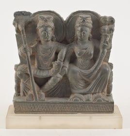 Carved schist architectural element. Gandharan. 2nd century BC. Scene of 2 seated divinities. 7.25 x