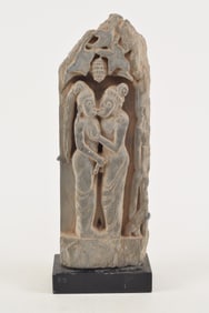 Carved schist sculptural element. Gandharan. 2nd century BC. Scene of 2 figures embracing. 14.75 x