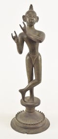 Bronze image of a deity. India. 18th century. Standing figure of Krishna. 15.75in high.