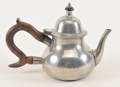 18th century English/American Queen Anne pewter teapot. Hallmark on base. 6.25 H x 8.75in W.