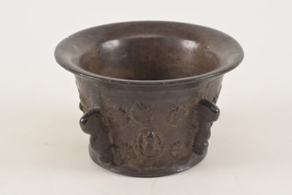 17th century heavy bronze mortar with flower and frog decoration. 5in diameter. 3in high.