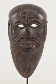 Carved wooden mask. Northern India. 19th century. Image of a Shiva devotee. Museum mount. 10 x