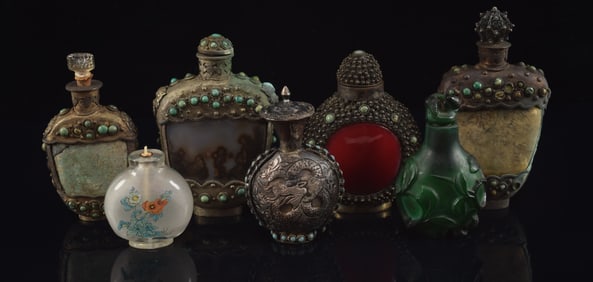 Lot of 7 snuff bottles. China. Early 20th century. 5 Mongol style bottles and 2 others. Largest 4in.