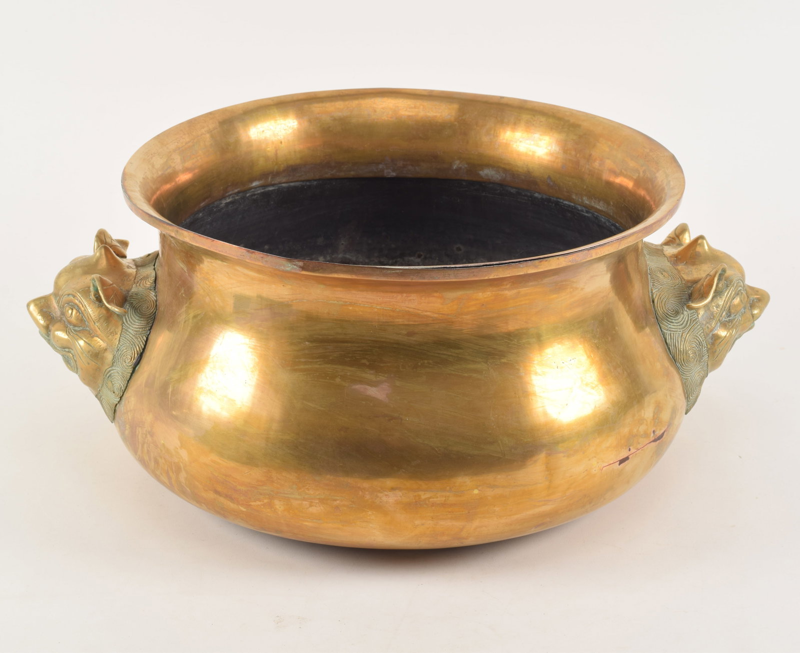 18th/19th century Asian gilt brass and copper wine cooler with buddhist lion mask handles. 18.5 W x: 18th/19th century Asian gilt brass and copper wine cooler with buddhist lion mask handles. 18.5 W x 7.5in H.