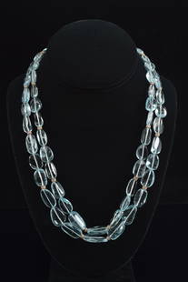 Designer 18K gold sapphire and diamond mounted dual strand necklace of polished semi-precious aqua: Designer 18K gold sapphire and diamond mounted dual strand necklace of polished semi-precious aqua color natural form stones. Clasp marked 750 and with indistinguishable maker's mark - possibly a thre