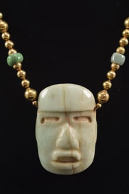 William Spratling 18K gold necklace with Pre-Columbian jade mask pendant. Gold bead strand with 2