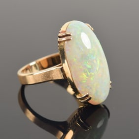 Vintage 18K gold opal mounted ring. Large oval opal measuring 21.1 x 11.2mm. Marked 18K and other