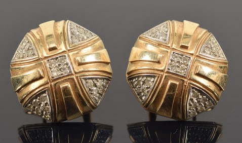 14K gold octagonal form diamond mounted earrings. Raised cross form decoration. Marked 14K and JM.