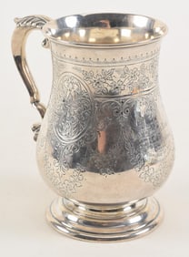 Victorian sterling silver cann, elaborate engraved panels and garlands, scroll handle with applied