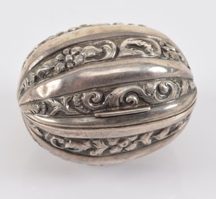 Victorian sterling silver walnut form nutmeg grater. Hallmarked on rim. Length, 1.5" .5 ozt.