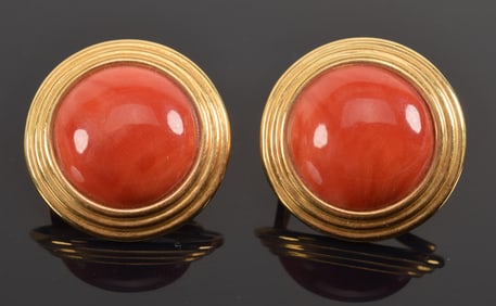 18K gold designer coral mounted earrings. Round coral cabochons measuring 14.5mm diameter each.