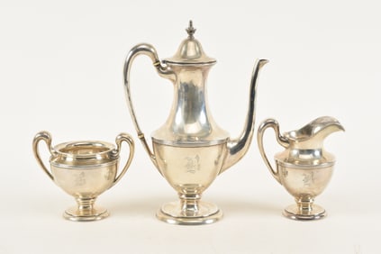 William Nost Co. sterling silver 3-piece tea set. Classical form. Teapot 10in high. Several slight