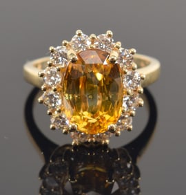 14K gold 4.51 CT natural yellow Ceylon sapphire and diamond ring. Oval cut sapphire measures approx.