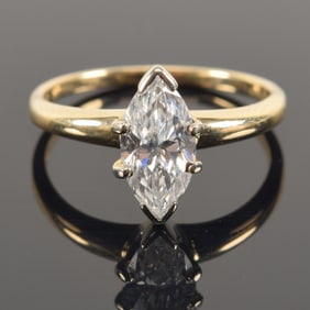 14K gold and platinum marquis diamond solitaire engagement ring. Diamond measures 5.1 x 10.8mm