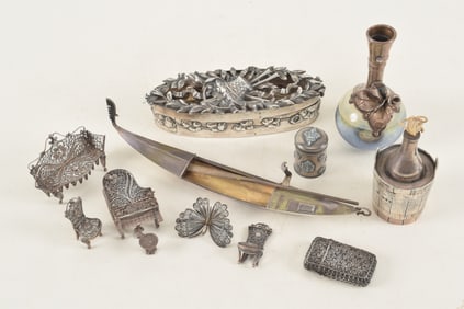 Group of continental silver decorative items. To include: English sterling reticulated covered oval
