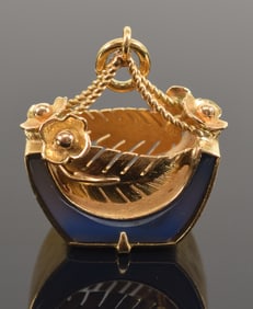 18K gold pendant with blue glass and feather and flower decoration. Marked 18K and Italy. 0.75in