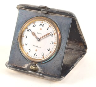 19th/20th century Tiffany & Co. travel clock. Pocket watch form mounted in a silver plated travel