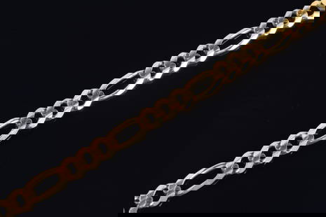 14K gold chain link bracelet. 8in length. Marked 14K, Romania. Slight dents/wear near clasp. 19.6: 14K gold chain link bracelet. 8in length. Marked 14K, Romania. Slight dents/wear near clasp. 19.6 grams.