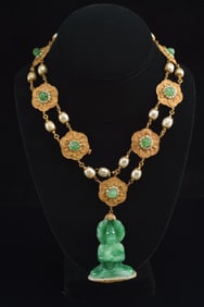 Miriam Haskell vintage Chinese style green glass and pearl decorated necklace with buddha pendant.
