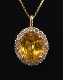 14K gold 3.70 CT natural yellow sapphire and diamond pendant necklace. Oval cut sapphire measures