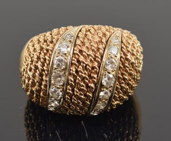 14K gold diamond ring with 2 channels of graduated small round cut diamonds in a rope twist design