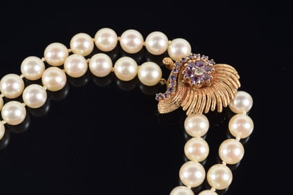 14K gold amethyst and diamond mounted clasp dual strand pearl necklace. Marked 14K. 24.5in length.