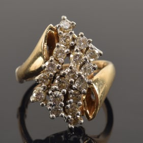 14K gold diamond cluster ring. Cluster of 3 tiered channels with 6 round cut diamonds in each.