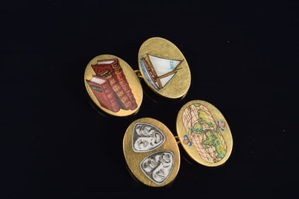 English 18K gold cufflinks with enamel decoration of books, sailboats, theater masks, and a globe.