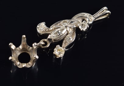 14K white gold diamond mounted pendant. Floral design with round and marquis diamonds. Open setting