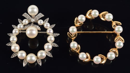 2 14K gold pearl wreath form pins. 1 yellow gold; the other white gold with diamonds. Largest 1.25in