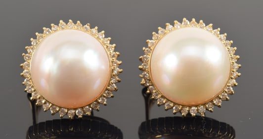 14K gold mabe pearl and diamond earrings. Central pearl measuring about 15.8mm diameter with small