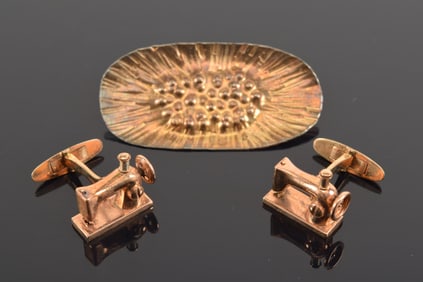 Lot of 2 jewelry items. 1) Pair of sewing machine form cufflinks. Marked 14K and ASAHI. 10 grams. 2)
