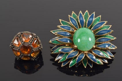 Lot of 2 jewelry items. 1) Mid century Ciner enamel decorated tiered floral pin with large faux jade