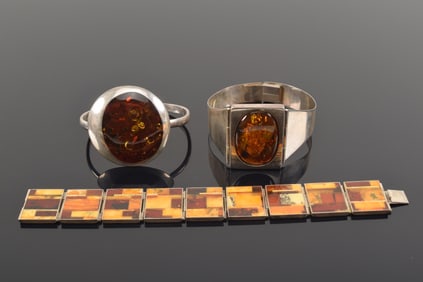 3 pieces of silver and amber jewelry. To include: 1) bracelet with amber mosaic panels. 7.75in
